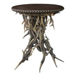 A Rustic  Scottish Circular Antler Table w/Embossed Leather Top