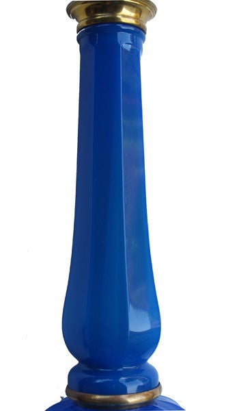 A fine and striking pair of Danish 1950's royal-blue opaline baluster-form lamps by Bing & Groendahl Heiberg; of faceted deep royal-blue opaline glass, each with long neck above a waisted mid-section over a bell-shaped base
