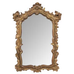 A Richly-Carved Italian Rococo Style Giltwood Mirror