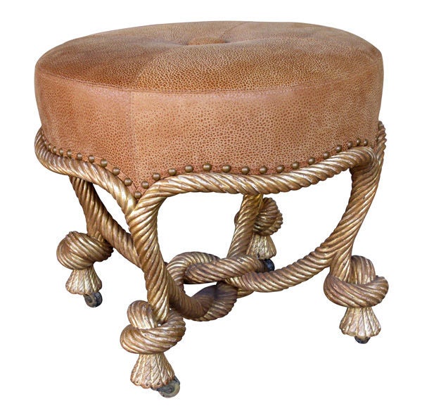 A food French Napoleon III carved giltwood rope-twist stool after the model by A.M.E. Fournier; the circular seat above a rope-twist frieze, with conforming legs ending in casters joined by a knotted stretcher