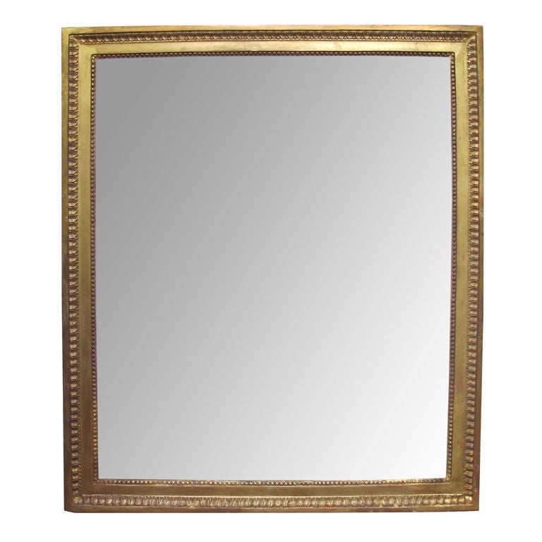 An Elegant French Restoration Rectangular Carved Giltwood Mirror