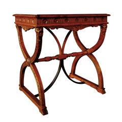 A Handsome Italian Renaissance Revival Carved Walnut Side Table with Curved Iron Stretcher