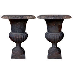A Boldly-Scaled Pair of French Cast-Iron Campagna Urns
