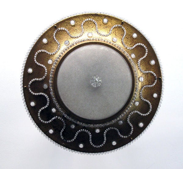 A chic French mid-century gilt-tole and beaded ceiling light with frosted glass bowl; in the manner of Maison Jansen; the flared frosted glass center support above a similar glass bowl within a splayed gilt-tole frame inset with glass beads and