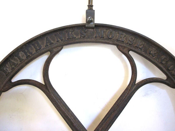 An Over-Scaled Pair of American Iron Coffee Grinder Wheel Lamps