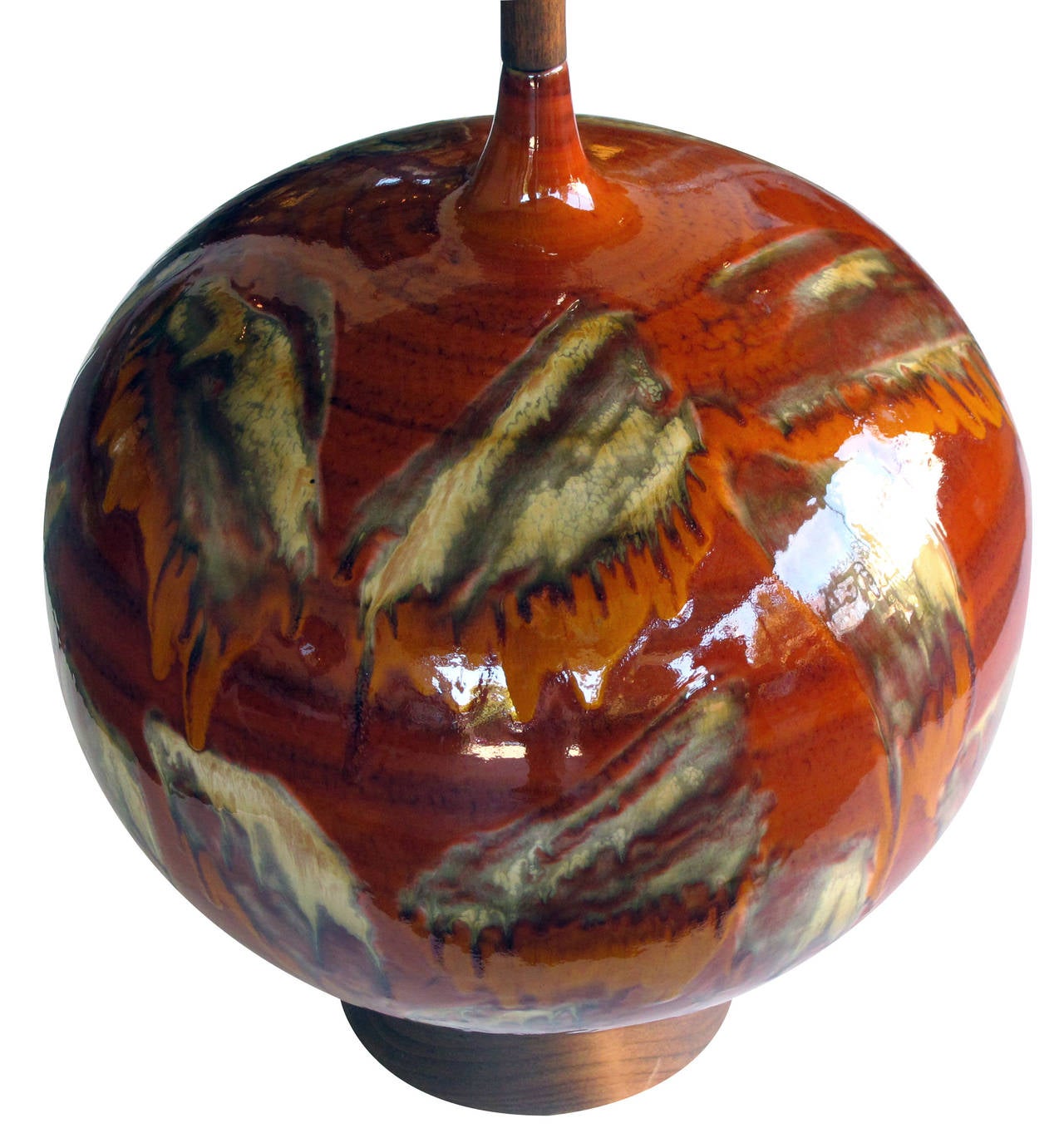 An impressively large Danish 1960s burnt orange and brown drip-glaze ceramic orb-form lamp; the large lamp with abstract drip glaze in rich earth tones; resting on a walnut base.