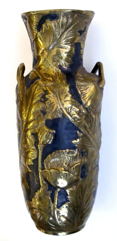 A fine French art nouveau gilt-bronze double-handled 'pavots' vase; signed 'Vibert' (French sculptor Alexandre Vibert 1847-1909); the flared neck above an ovoid body; adorned overall with relief decoration of intertwining leaves and poppy heads with