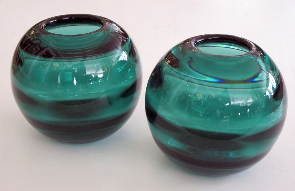 A rare pair of Swedish art deco Orrefors iridescent green art glass globular-form vases; by Edward Hald; etched 'Orrefors1930HZ48'; each thickly modeled round vase of deep iridescent green glass with polished opening