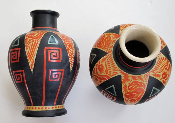 An iconic pair of Japanese art deco Satsuma porcelain ovoid vases by Kinkozan; underglaze mark 'Kinkozan - Made in Japan'; each portly vase with short neck and rolled lip above an ovoid body ending in a splayed foot; thick burnt orange glazed
