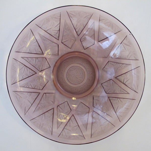 A large-scaled French Art Deco frosted and clear amethyst glass bowl with geometric design; with raised mark 'Verlys France'; the wide bowl with flared lip above a tapering body all raised on a raised foot; the underside with recessed frosted