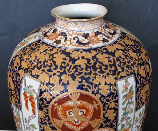 A large and well-executed pair of French Samson polychromed porcelain ovoid vases in the Chinese taste; with typical pseudo Chinese markings; each with everted lip above a dramatic ovoid body decorated with matte and burnished gilt foliate vines;