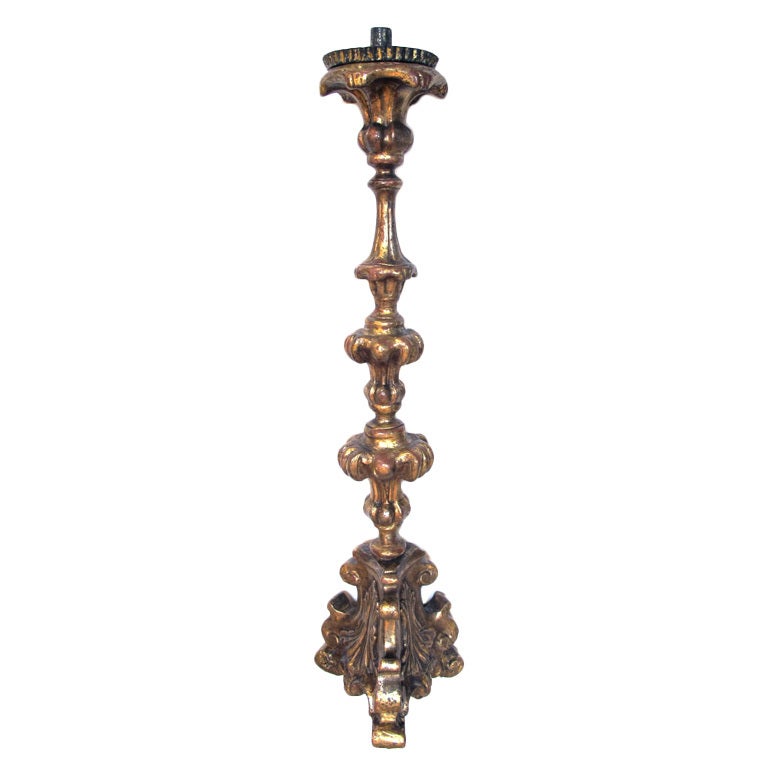 A Boldly-Scaled Italian Baroque Carved Giltwood Candlestick For Sale