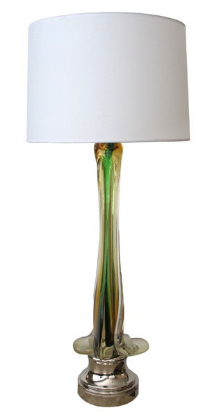 A tall and striking pair of Murano 1950's lamps of swirling butterscotch encased glass with green highlights; by Seguso; each tall graduated encased glass lamp surrounding a center of butterscotch-colored glass with vibrant green streaks; the clear