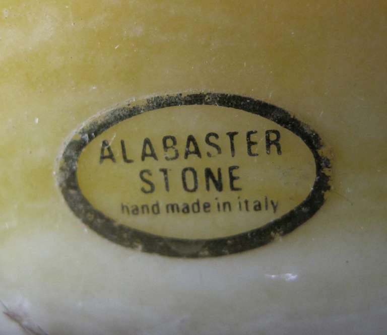 A large-scaled and elegant pair of Italian urn-form butter-yellow and ivory alabaster lamps; with label 'Marbro Lamp Co. Los Angeles'; 'Alabaster Stone, Hand-Made in Italy'; each richly-colored urn-form lamp with a flared neck above a lobed bulbous
