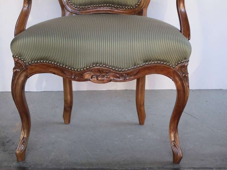 An Well-Carved Set of 4 French Louis XV Style Walnut Open Armchairs 2