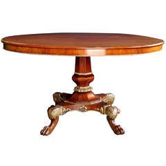 A Good Danish Empire Walnut & Parcel-Gilt Oval Quadruped Center Table