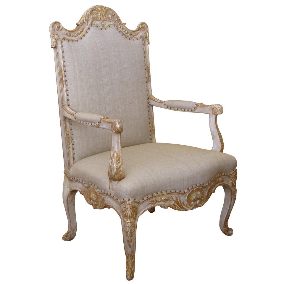 A Baronial French Regence Style Ivory Painted Open Armchair For Sale