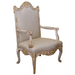 A Baronial French Regence Style Ivory Painted Open Armchair
