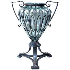 A Large Murano Aquamarine Blown Glass Urn in Wrought Iron Frame
