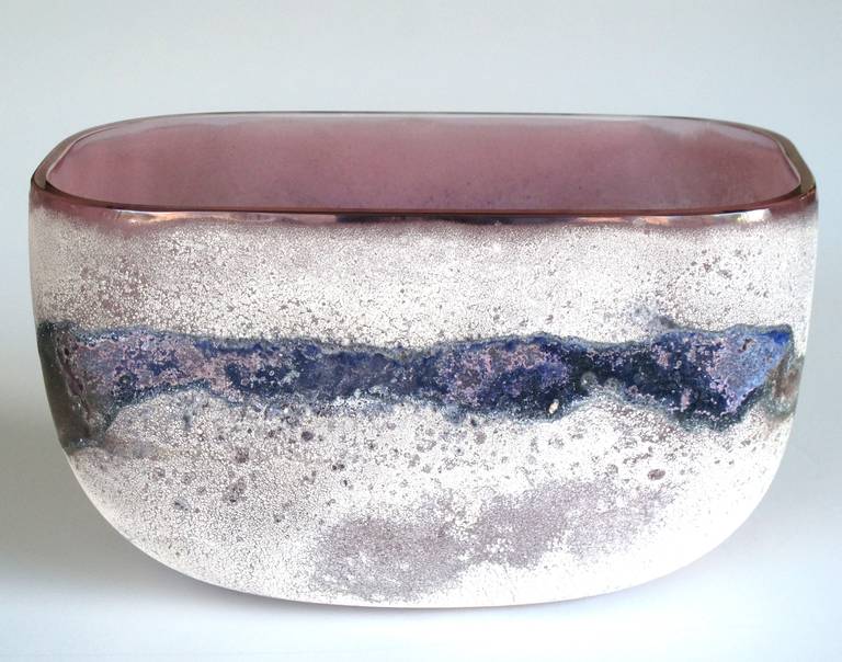 A rare Murano 1960s Alfredo Barbini 'scavo' glass bowl; etched signature 'Barbini Murano' on underside; the oval-form bowl with acid-etched 'scavo' surface in hues of purple and blue.