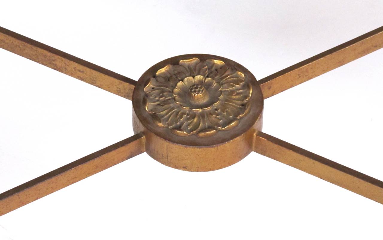 A good quality and elegant French 1940s tray table by Maison Baguès, Paris; the shaped lacquered tray centering a floral bouquet surrounded by birds and butterflies; raised on a faux bamboo gilt metal stand.