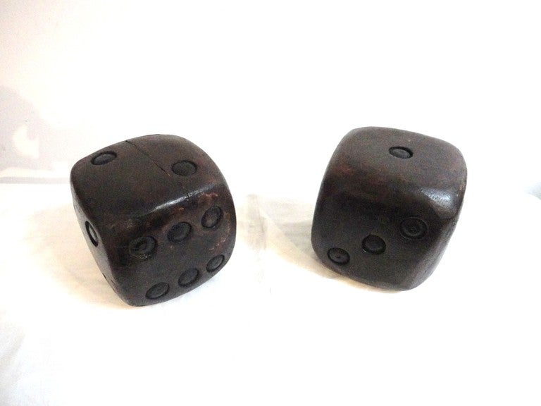 Wonderful very large natural old surface dice with original black painted dots and original old varnish surface.Sold as a pair.This pair looks and feels much old then most dice.Great on a bookshelf or coffee table.