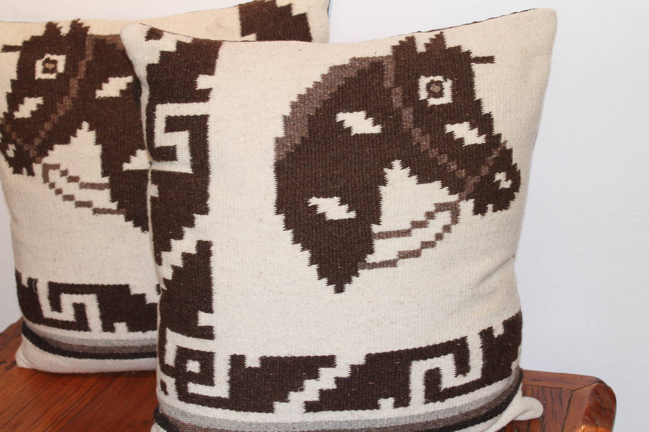 These cool pillows are made from a  hand  woven Indian saddle blanket with horse heads. The backing is in a dark brown cotton linen.