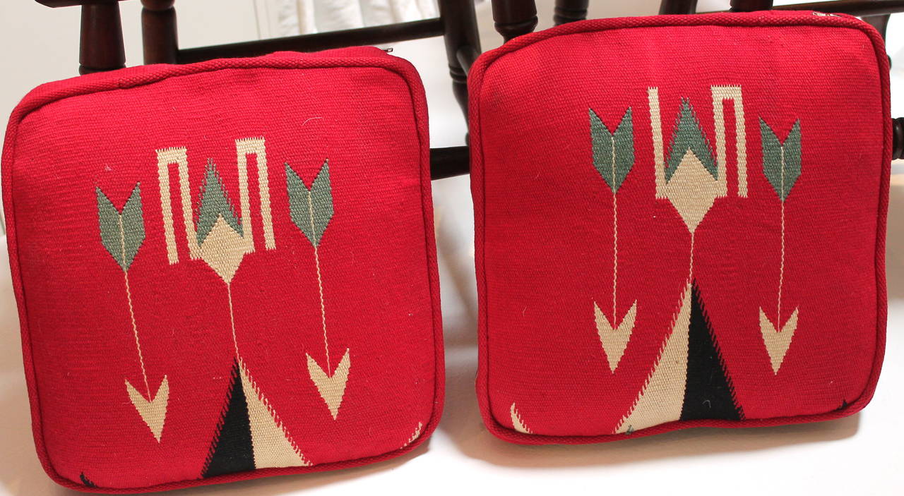 This pair of custom-made chair cushions are made from a vibrant Mexican Indian serape fabric. They are totally reversible and washable as they have zippers for removing the inserts. The inserts are down and feather fill. The greatest look on a
