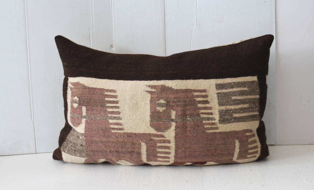 These fun and folky horses are the most calming, organic Mexican weaving with a natural linen backing. The condition is very good. The insert is down and feather fill.