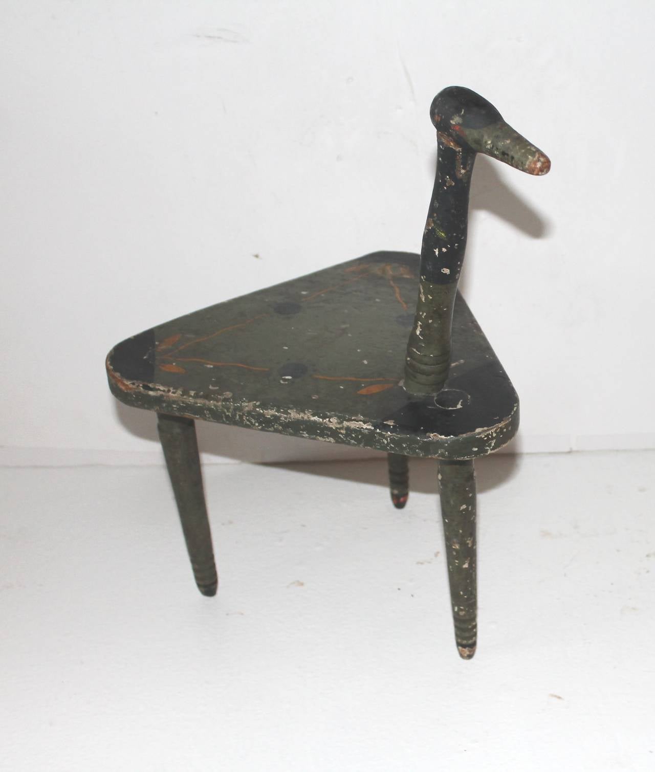 This we believe to be a child's chair with the ducks neck being a thing to hang on to. It has such a crazy folky look to it. It is signed France on the base. What a great piece of Folk Art. The condition is good and sturdy with minor paint loss from