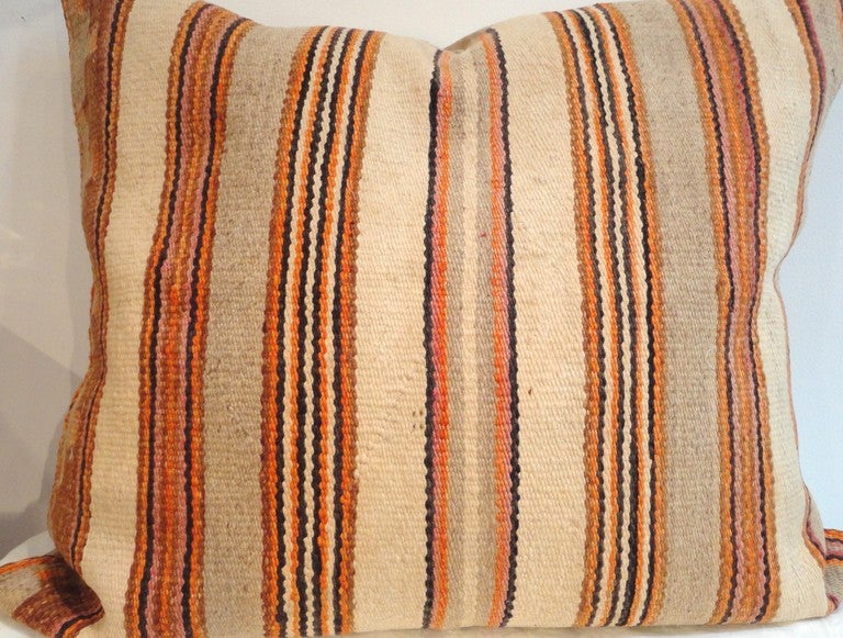 Fantastic Navajo Indian saddle blanket  weaving large pillow.This amazing down & feather filled pillow is the most unusual colors and condition.The rust ,tan and cream colors are so rarely seen in Navajo weaving's.This is a large tv throw pillow in