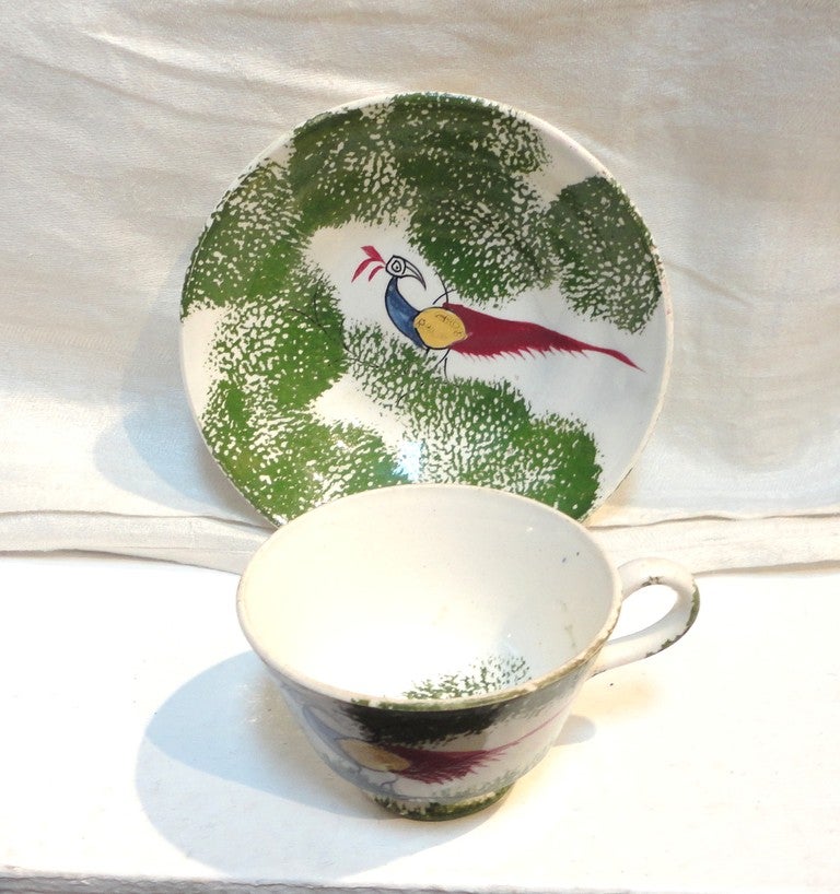 This rare and early Pennsylvania 19th century stick spatter peafowl stick spatter child's cup and saucer set is in great condition. This fantastic Folk Art soft paste is mostly found in Pennsylvania. The children's pieces are the most rare to find