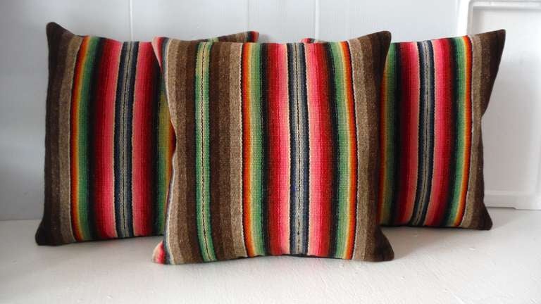 These colorful serape weaving’s are very unusual and bold stripes. The backings are in a chocolate brown linen. The inserts are down and feather fill. Sold individually at 495.00 each / six in stock.