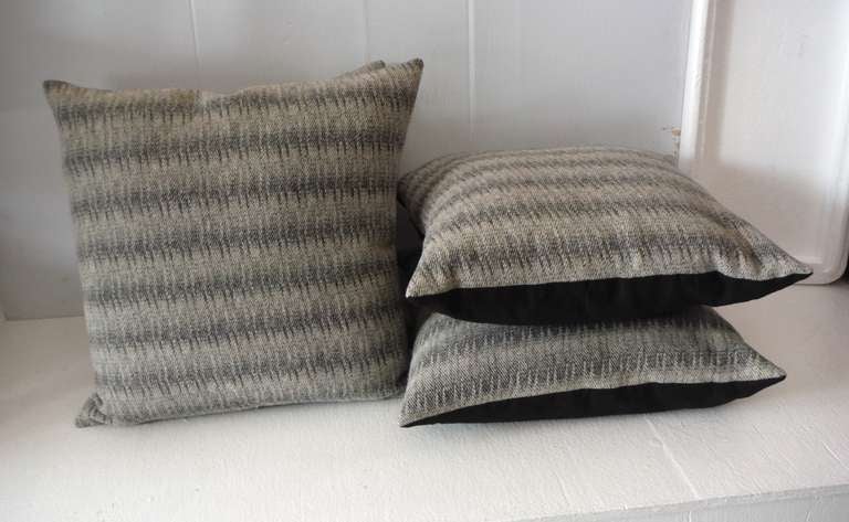 Early soft wool Indian weaving pillows with cotton linen backings. The inserts are down and feather fill. Sold in pairs. Six pillows in stock.