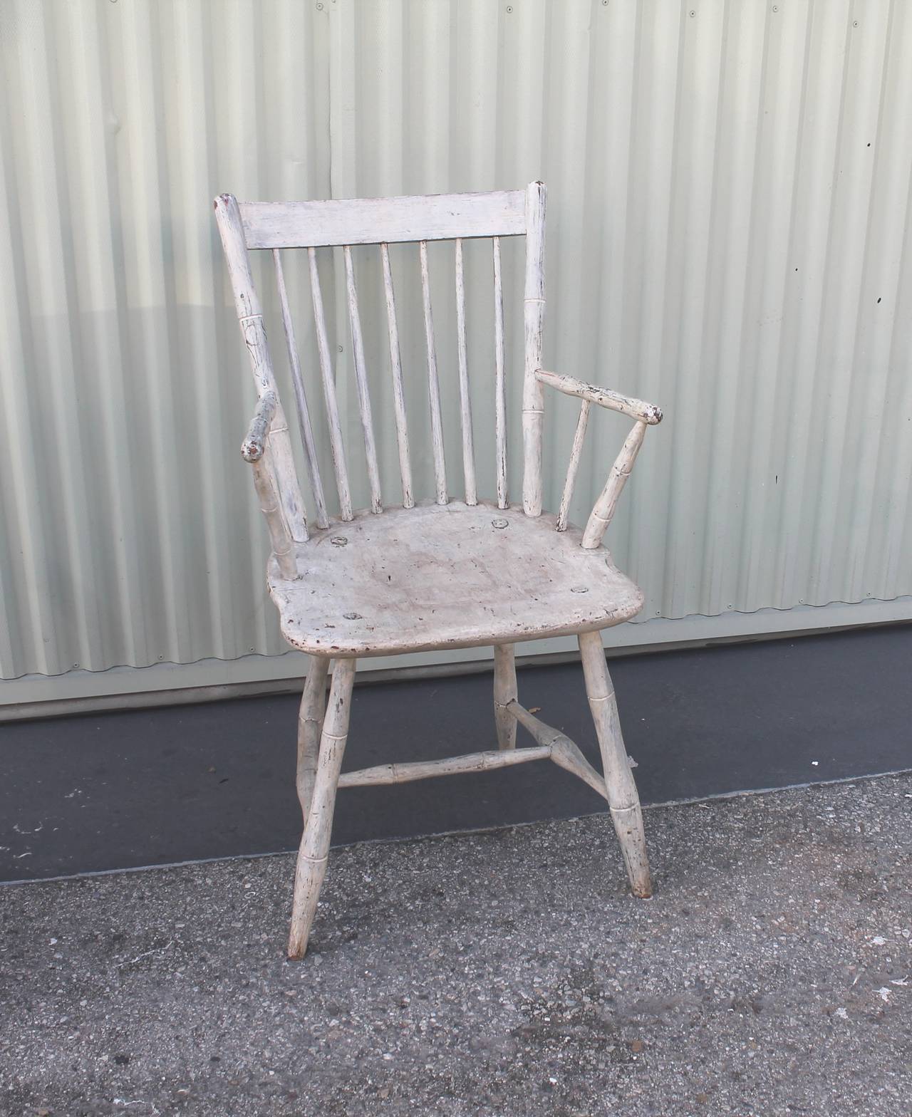 This fine New England original white painted country Windsor chair has such great form and a wonderful undisturbed surface. Found in Pennsylvania and has such a great simple early form. Super untouched patina.