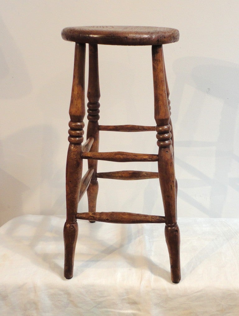 This 19thc oak pub bar stool has good height and is very sturdy condition. It is always hard to find bar stools in this condition. The patina is mellow and has a wonderful old stain finish.