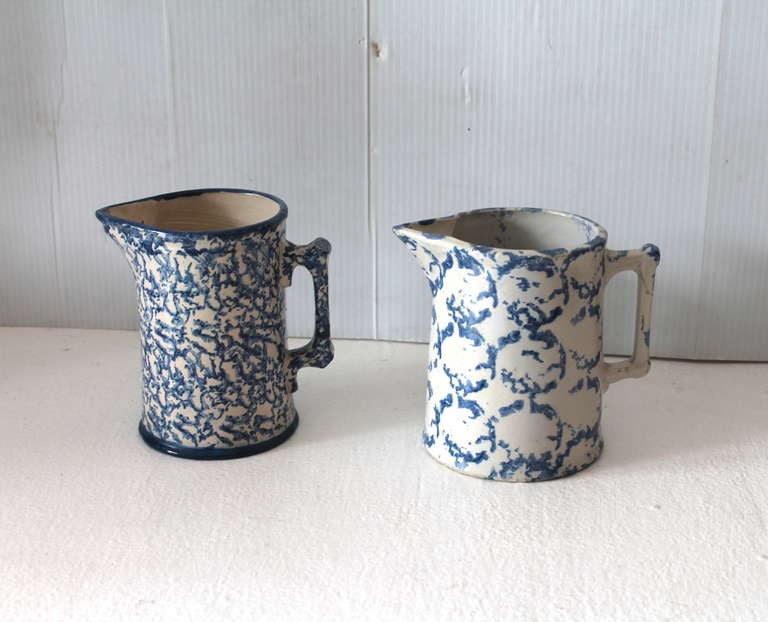 This group of sponge ware pitchers are in good condition with a minor hair line in the pitcher to the right. This size pitcher were used for cream or milk on the table or in the pantry. The circular pattern sponge pitcher. It does not detract at all