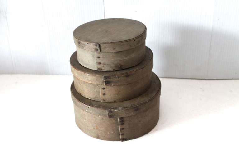 This amazing collection of matching 19thc graduated sizes & original putty painted boxes are in great condition . The pantry's are all in the same amazing surface and were found in the state of Vermont .These  New England pantry boxes are a great