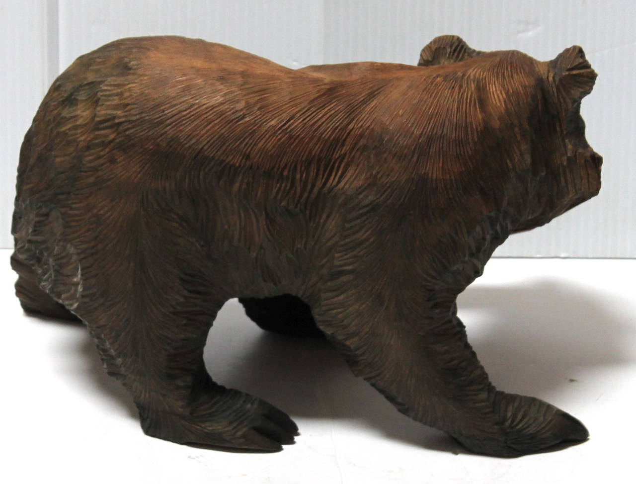 bear with fish in mouth statue meaning