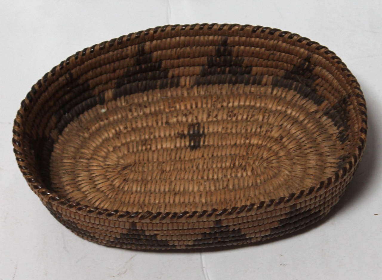 Amazing scale and condition on this oval geometric Papago Indian basket. Great addition to any Indian or Americana collection.