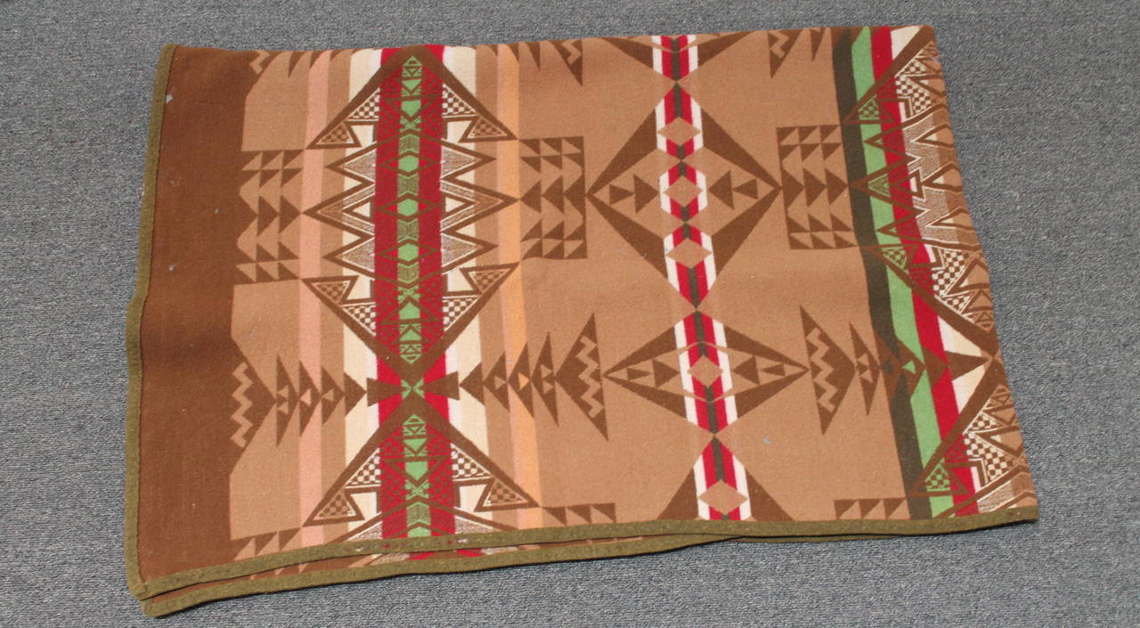 This blanket has the original Cayuse label. The condition is very good with it's original binding edge. The pattern is quite geometric Indian design and in very good condition. This blanket has all the bells and whistles.