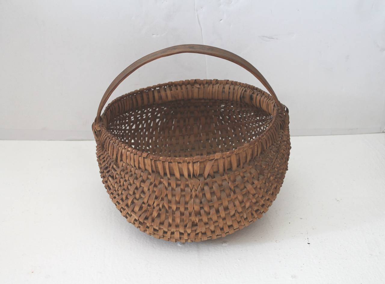 This is a very early Pennsylvania handwoven hiney basket in great condition. Nice early handmade nail construction and super surface.