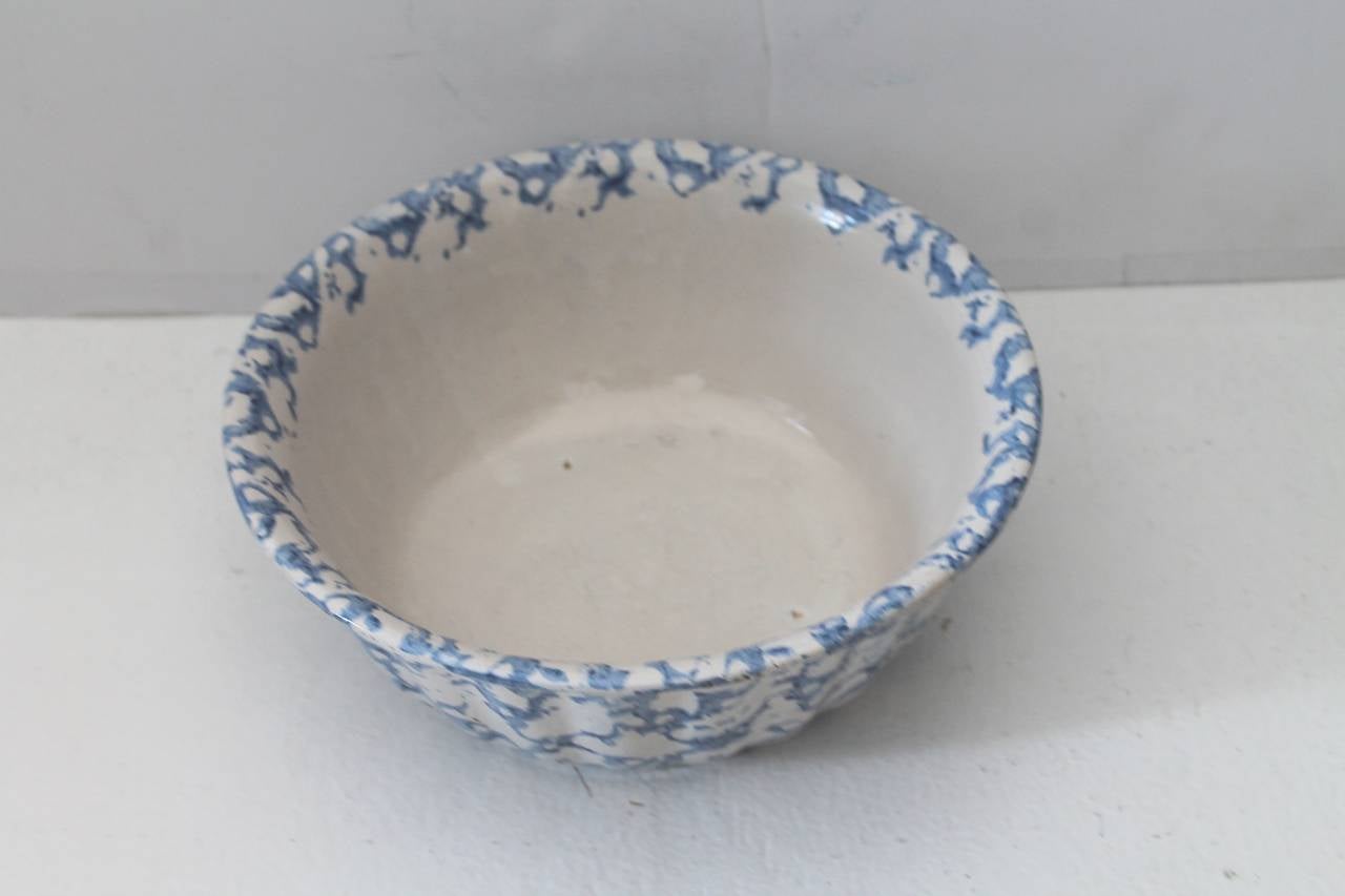 This is a large 19th century sponge ware serving bowl with a fluted rim. The condition is very good.