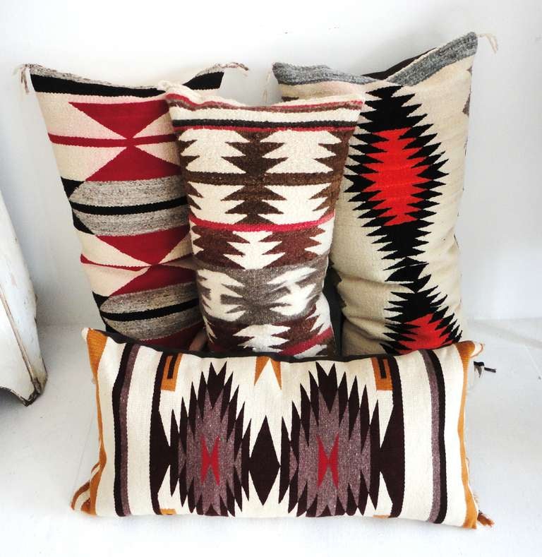 Fantastic Navajo Indian bolster pillows with cotton linen backings.Sold as a collection of four for 2400.00 or 750.00 each.