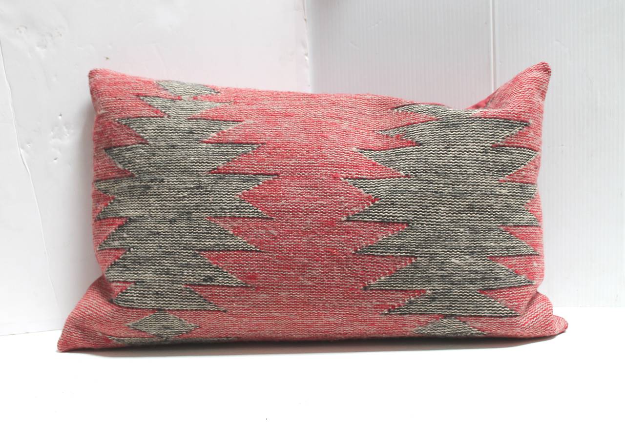 This is a set of three Navajo Indian weaving geometric bolster pillows. We are selling them as a collection of three bolster pillows in a streak of lighting pattern. They could be sold individually at 875. Each or as a group of three for 1850, for