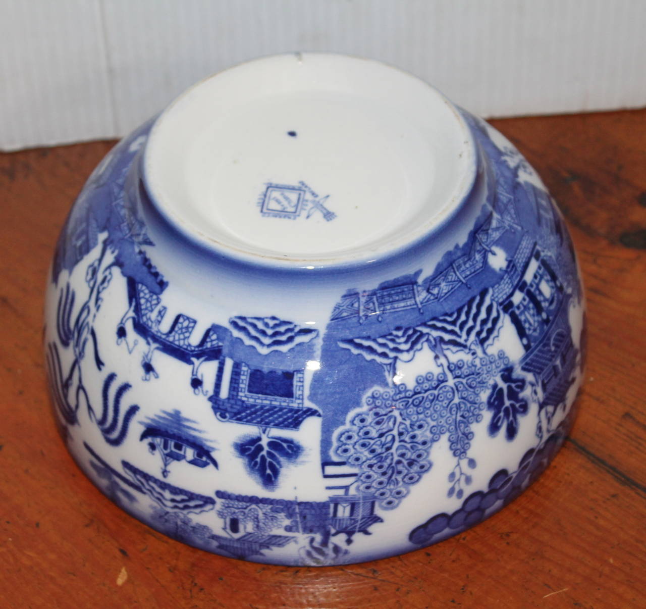 19th century large blue willow serving bowl in pristine condition. Marked made in England & Ridgway. This is a nice almost flow-blue surface.
