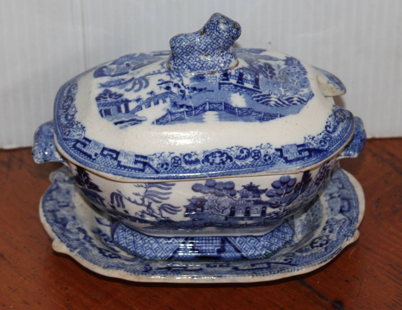 Three-piece set of early 19th century English blue willow diminutive tureen set. This early ironstone three-piece set is in mint condition and quite rare. The lamb finial is on the top of the lid. Condition is very good.