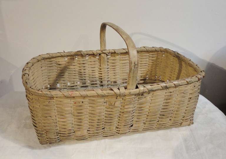 This large basket was probably a gathering basket for vegetables or fruit. The condition is very good with no breaks and very sturdy, strong condition.