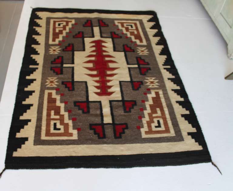 This wonderful early 1900's geometric Navajo Indian weaving or rug is in pristine condition. Minor wear hardly noticeable with the original corner ties. These great weaving's are very hard to find in this type of condition. The pattern is very