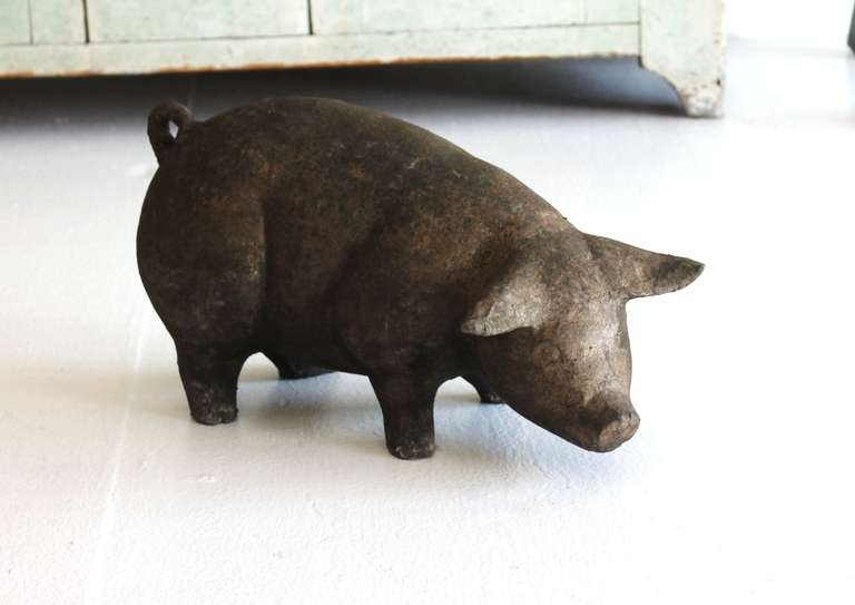 This little piggy is Americana Folk Art at its most charming.  The pig is constructed of a pressed composite material that was then covered in hand-crafted paper mache.  Perfect for any country or farmhouse themed interior.  The pig shows not chips